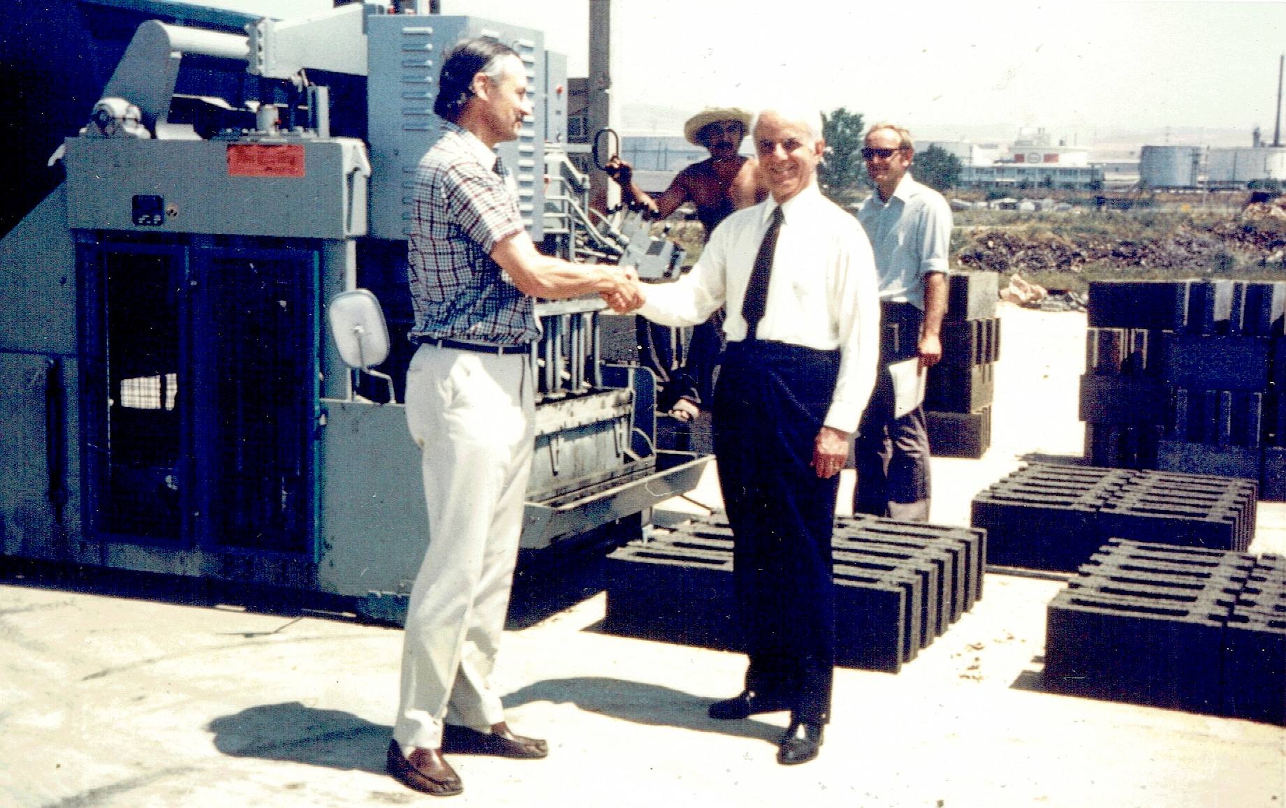 Marcel Paulos and plant foreman with Nelson Kruschandl (son of Edward) wearing sunglasses