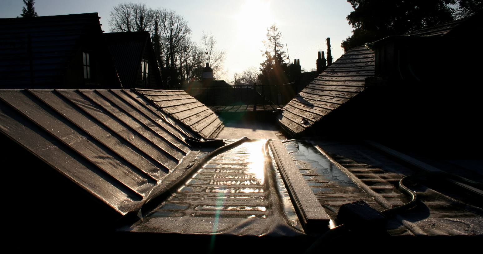 Christmas winter morning frost with sunshine bouncing off the rooftops