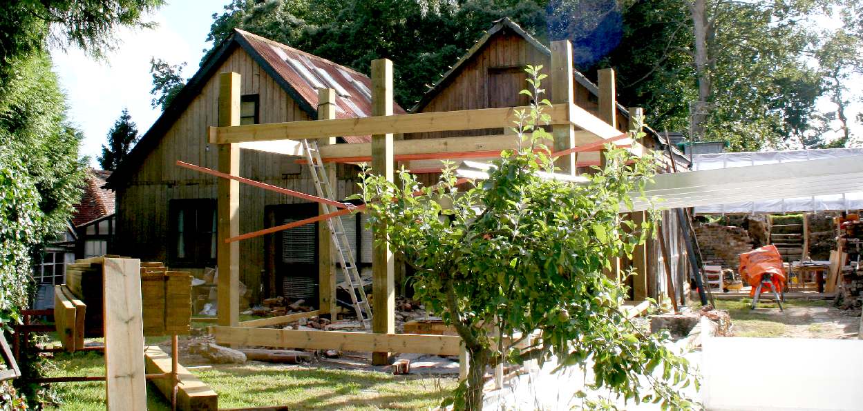 Roman garden wooden posts by Tate Fencing