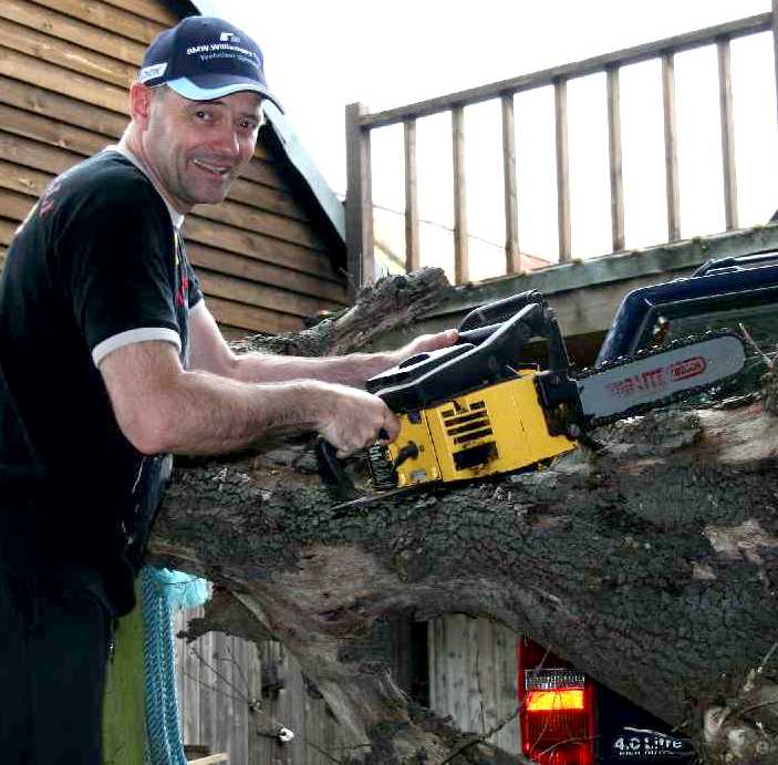 Nelson Kay using a chain saw